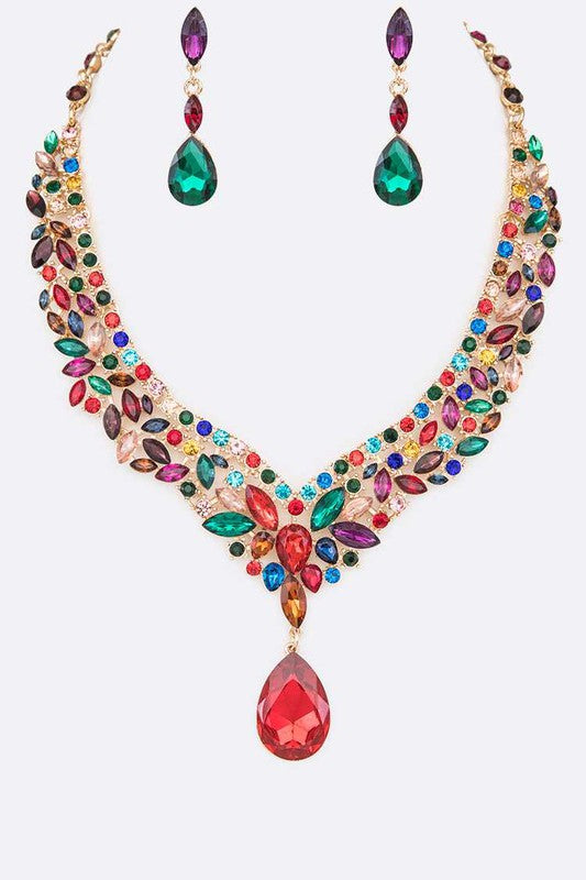 Make a bold impression with this Crystal Statement Necklace Set, featuring a 17" necklace with an extension and matching earrings with a 2" drop. Perfect for adding a vibrant touch to any outfit.