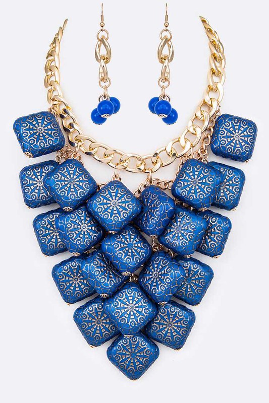 This set features a 16" necklace with an extension and matching earrings with a 3.2" drop, all crafted from textured wooden beads. Perfect for adding a natural, stylish touch to any outfit.